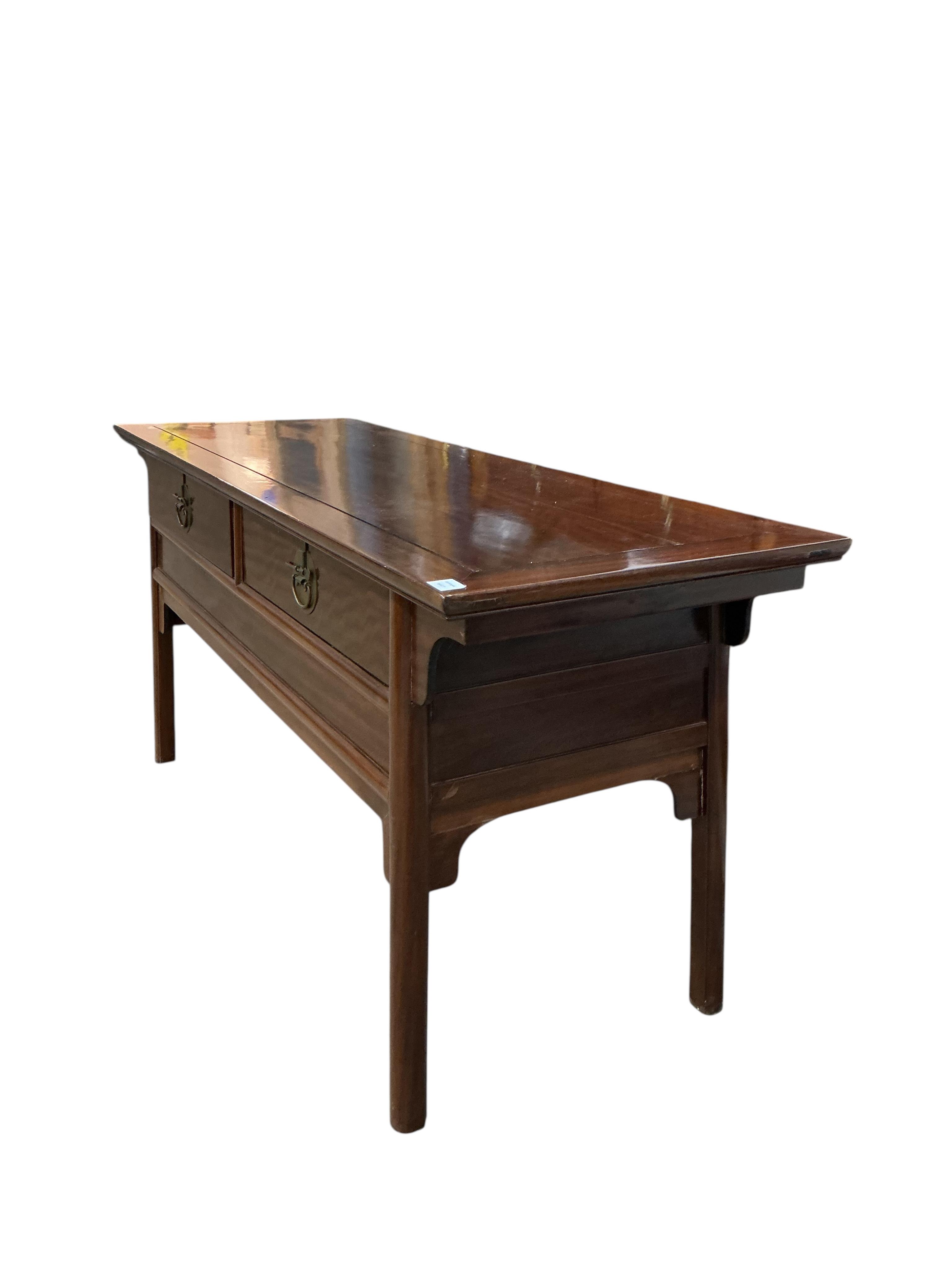 A Chinese hardwood two drawer serving table, width 172cm, depth 61cm, height 82cm